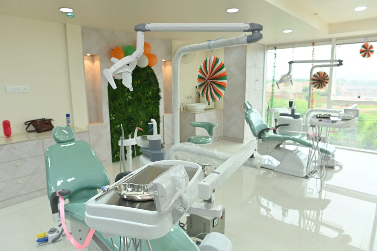 Dental chair, instrument tray and overhead light in the Care32 operatory, Kukatpally